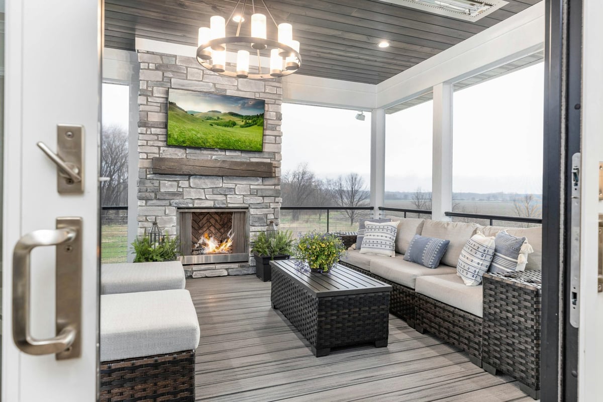 Patio TV over a stone fireplace