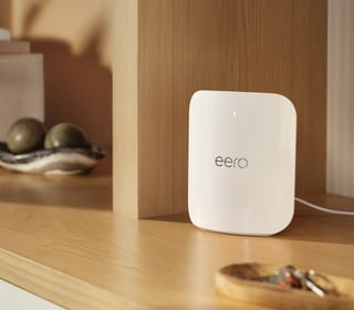 eero router sitting on a shelf