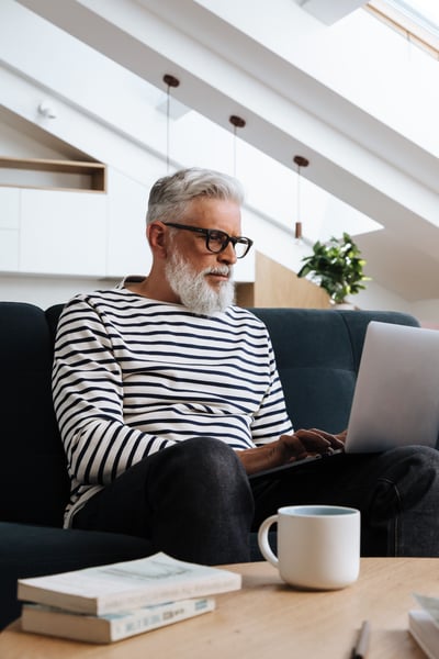 Dobson Fiber customer paying his bill online from a laptop at home