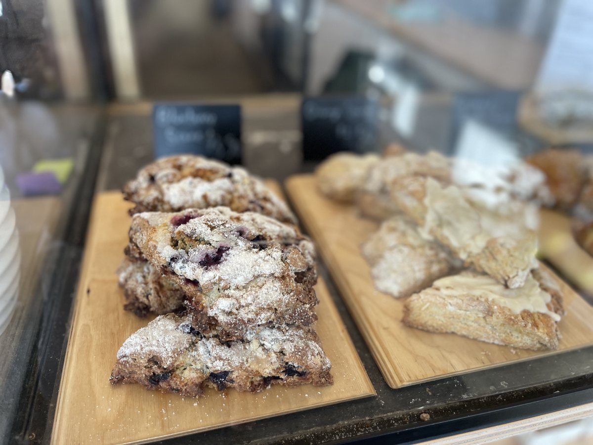 Sugar-crusted blueberry scones in the pastry case at Comma in Shawnee