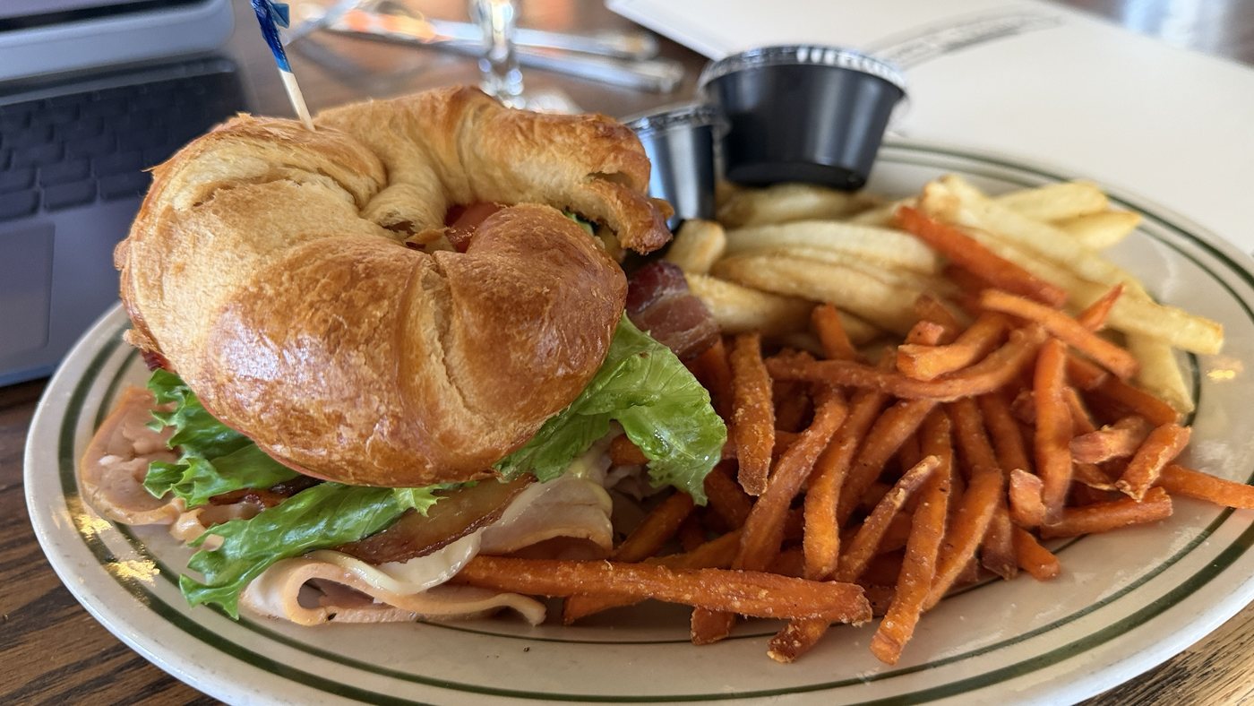 Turkey Troubador on a croissant with fries and sweet potato fries at McNellie's