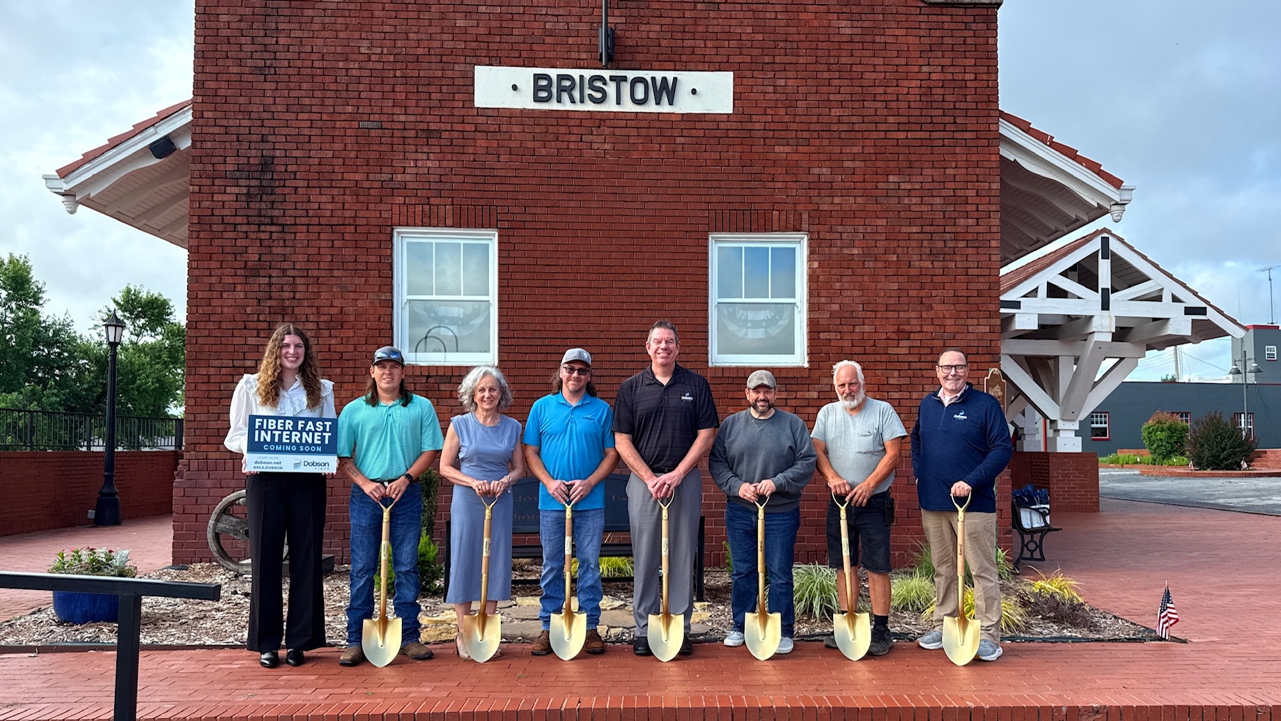 A group of people stand with shovels in Bristow, Oklahoma
